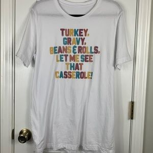 White short sleeved tee shirt bust 20”. Multi colored lettering. No tags